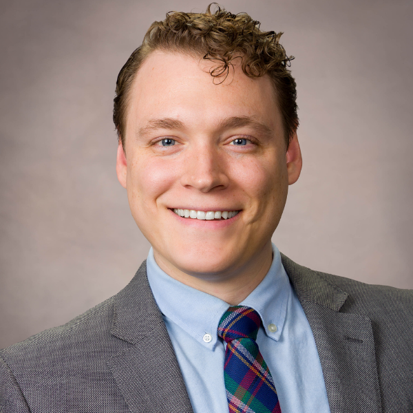 Headshot of Tanner Weyland, Marketing Specialist at RestoreInsure.